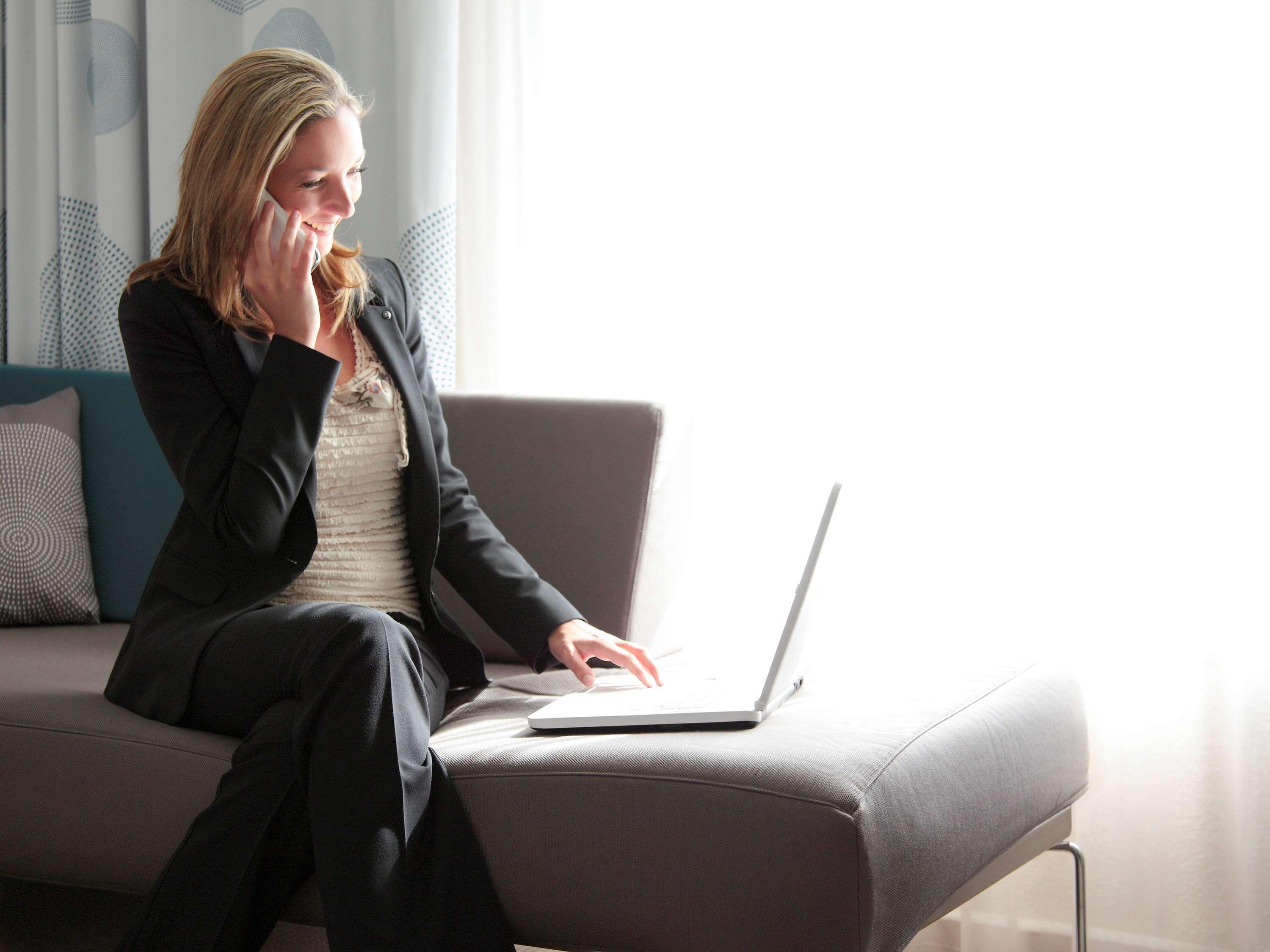 Novotel Chennai Sipcot 외부 사진 A woman working from home