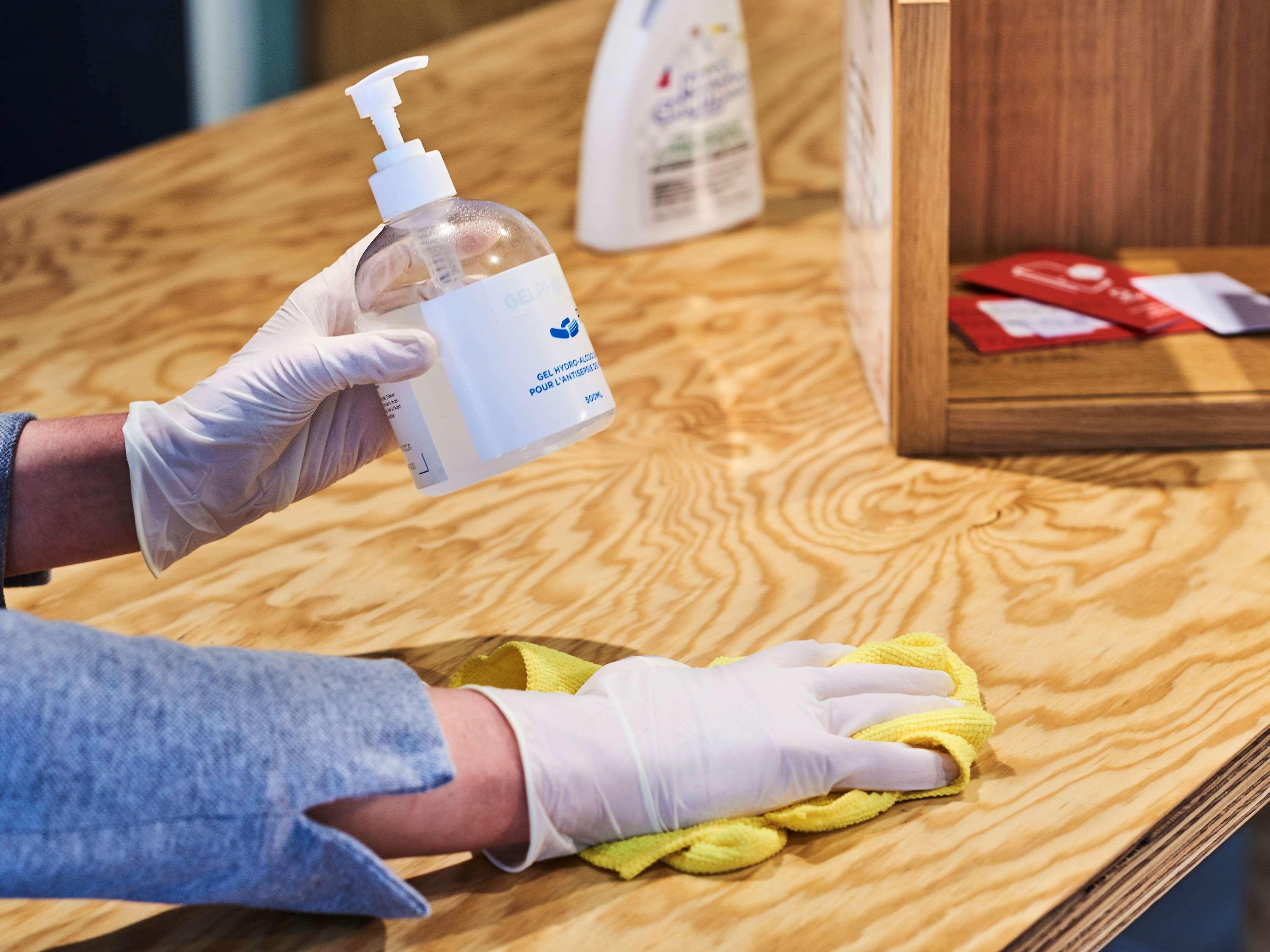 Novotel Chennai Sipcot 외부 사진 Disinfection of a table with a disinfectant